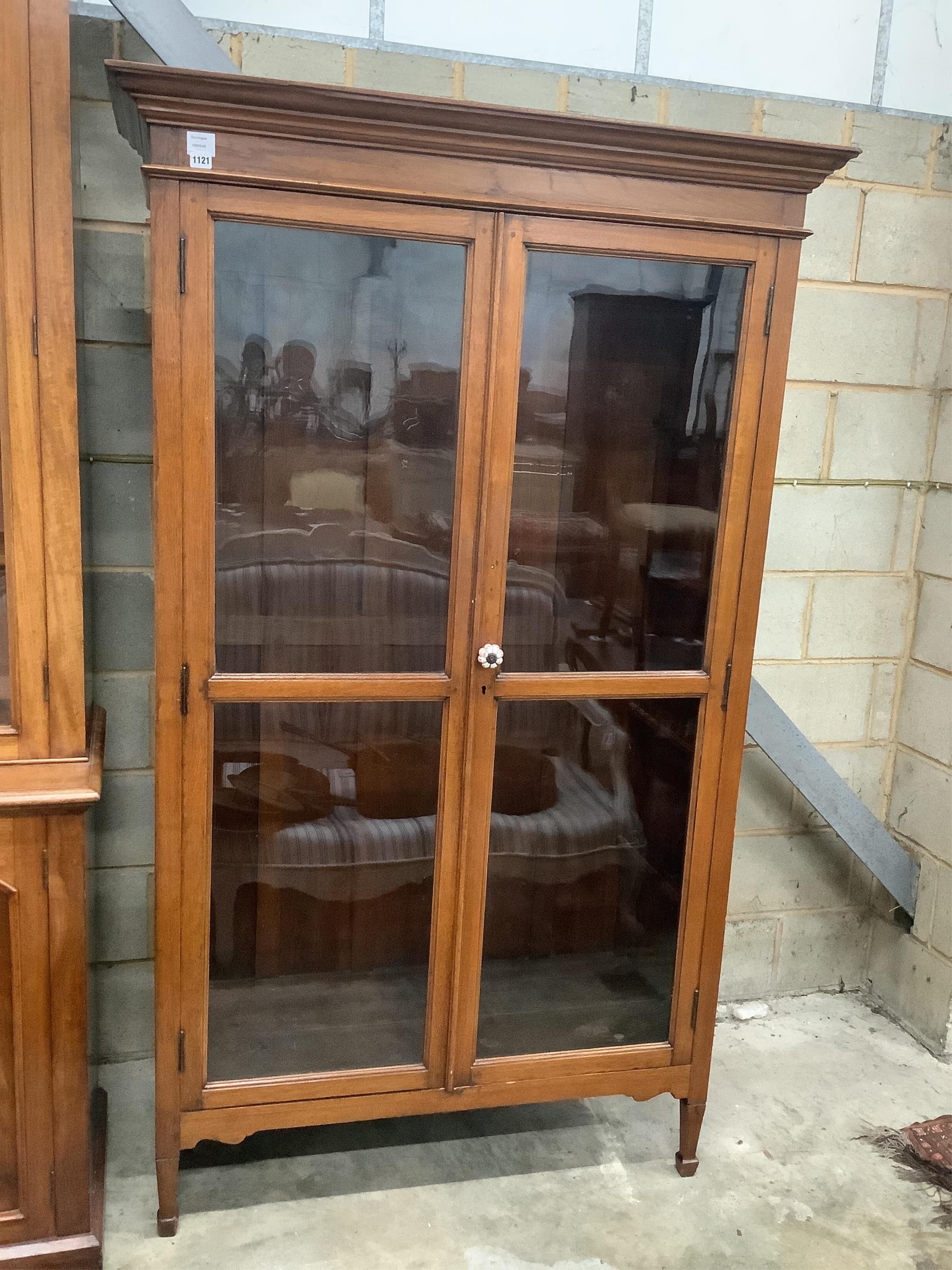 A late 19th century Indian teak glazed cabinet, width 120cm, depth 48cm, height 198cm. Condition - good